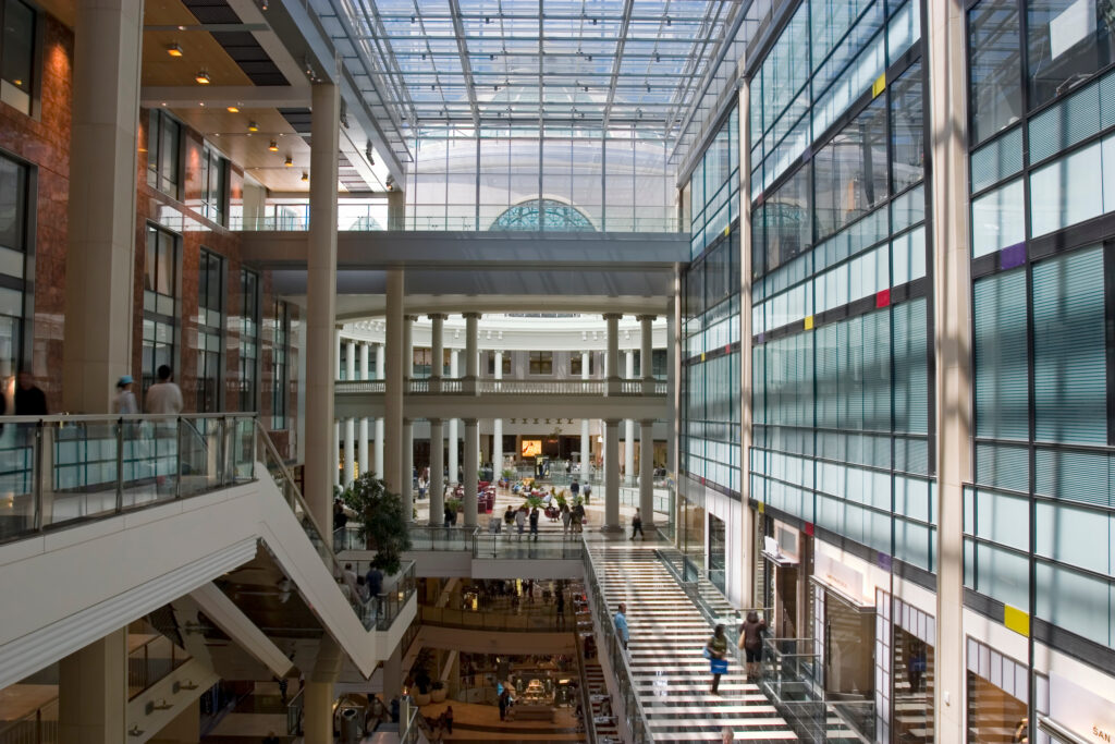 Interior view of a multi-story Long Island shopping center and retail stores, illustrating property owner liability when a customer is injured at a store, restaurant, or mall.